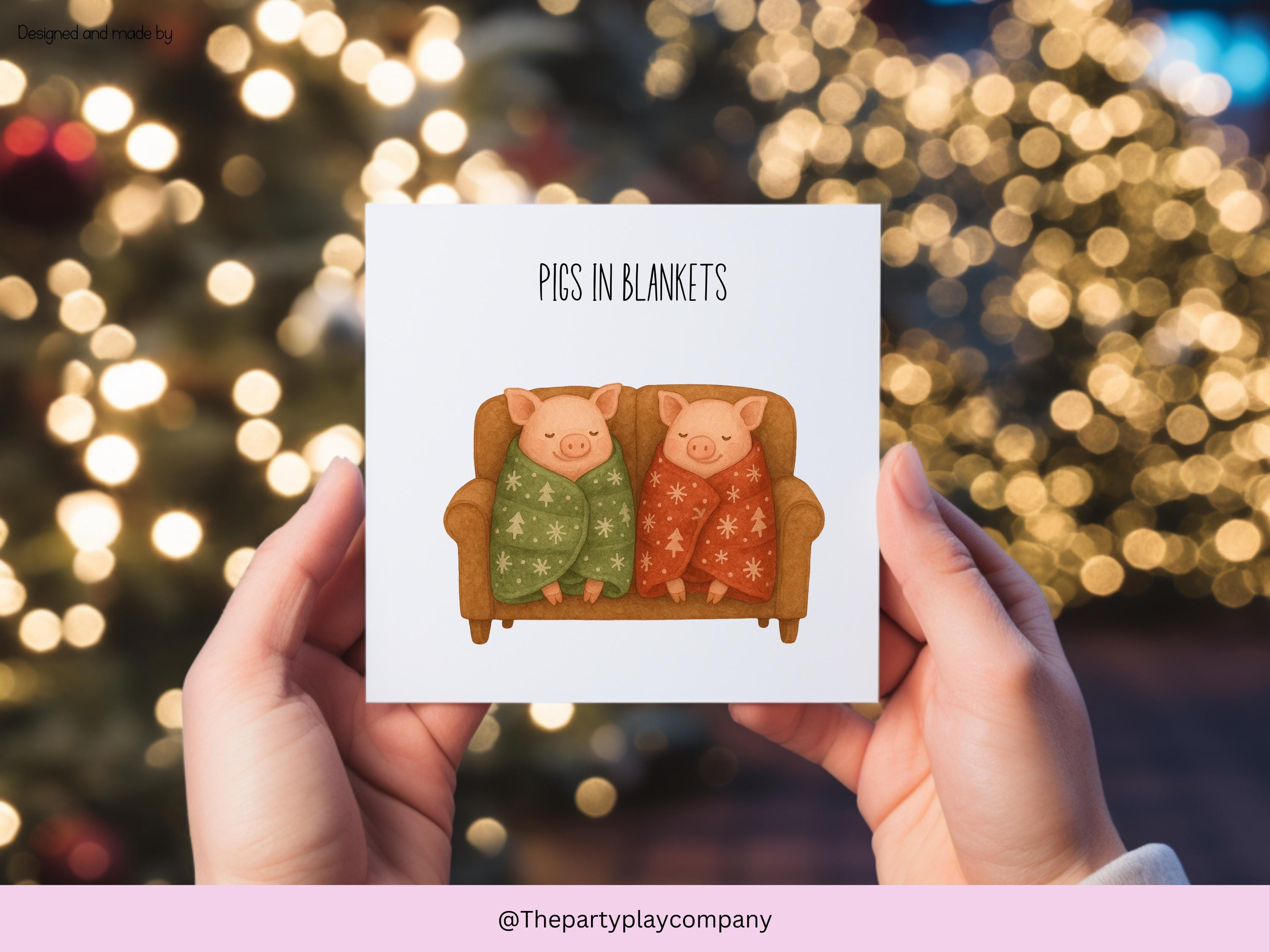 Funny Christmas Card | Pigs in Blankets Pun Xmas Card | Quirky Festive Animal Card | Cosy Sofa Scene Greeting | 4 for 10 Pound Offer