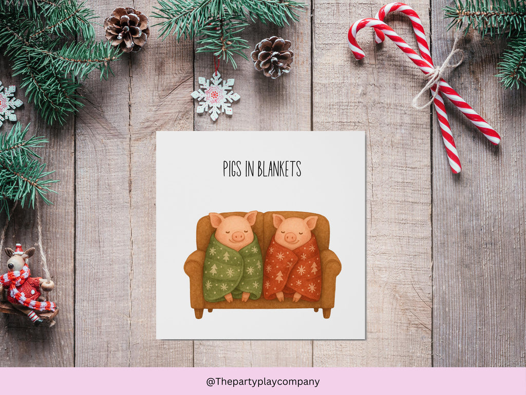 Funny Christmas Card | Pigs in Blankets Pun Xmas Card | Quirky Festive Animal Card | Cosy Sofa Scene Greeting | 4 for 10 Pound Offer
