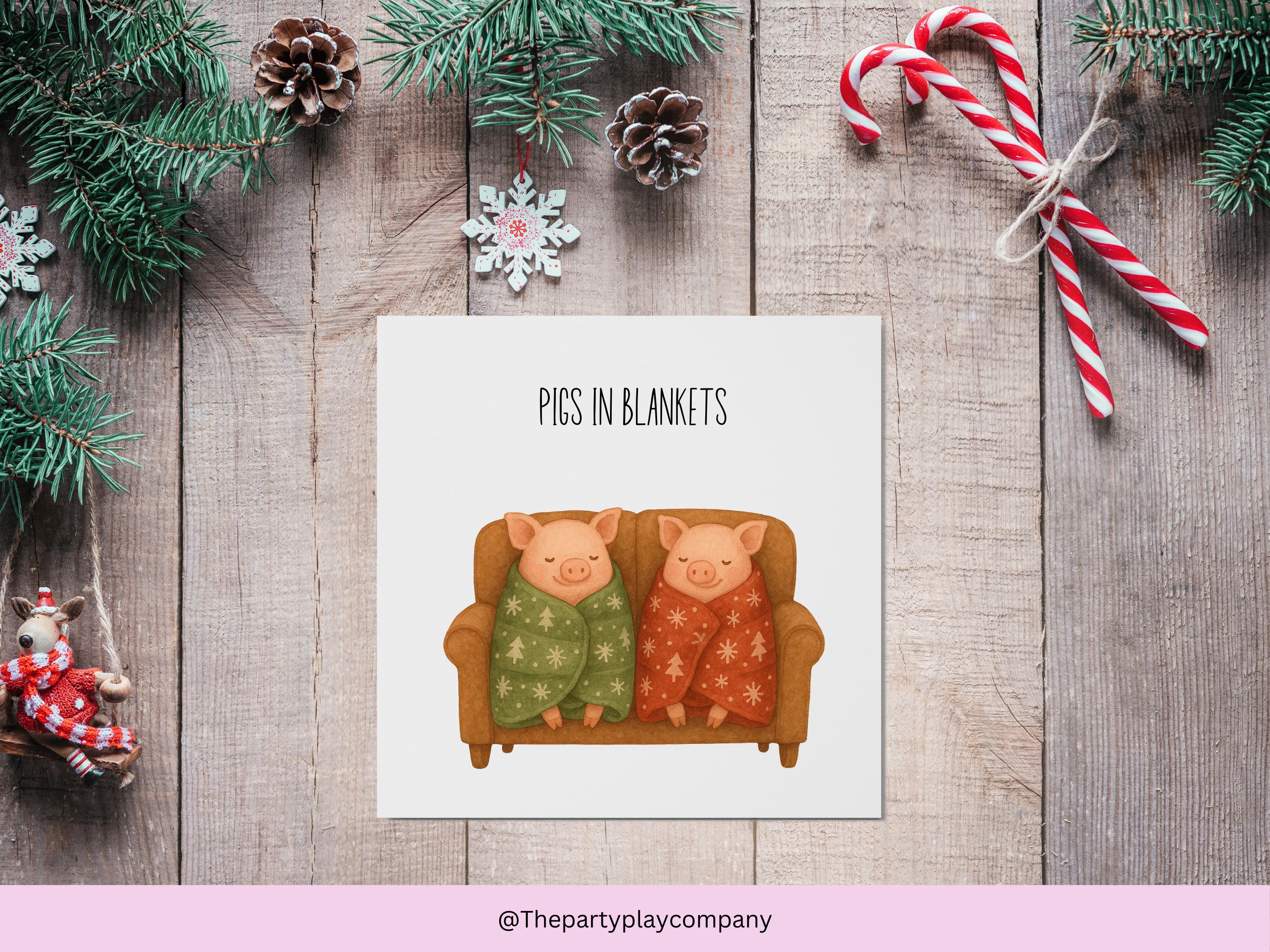 Funny Christmas Card | Pigs in Blankets Pun Xmas Card | Quirky Festive Animal Card | Cosy Sofa Scene Greeting | 4 for 10 Pound Offer