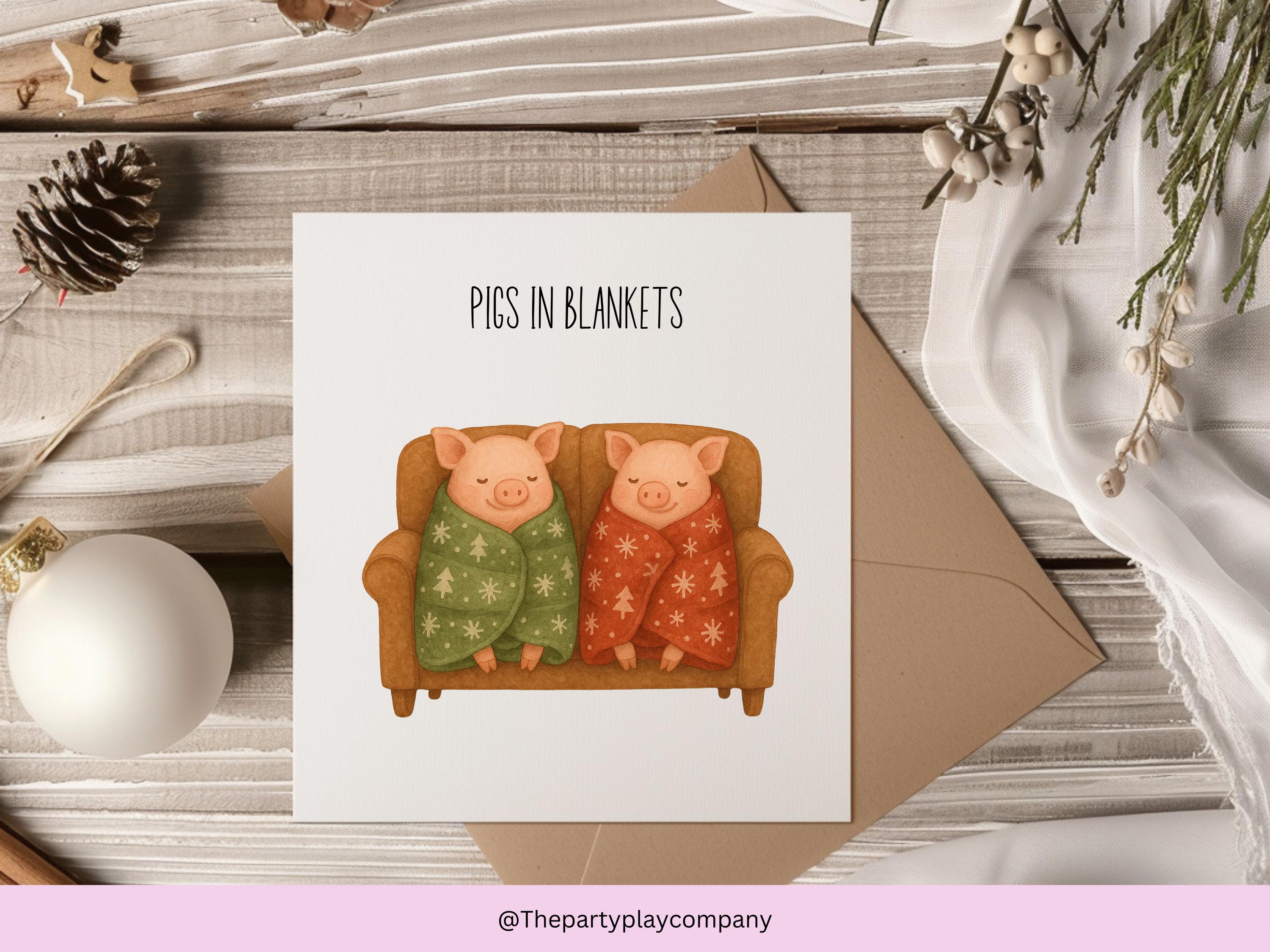 Funny Christmas Card | Pigs in Blankets Pun Xmas Card | Quirky Festive Animal Card | Cosy Sofa Scene Greeting | 4 for 10 Pound Offer